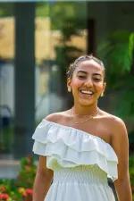 woman looking directly at the camera and smiling